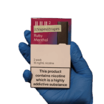 Clean fruity menthol burst with smooth chilled aftertaste — 베리 컬러그램과 아이시 민트 텍스처가 어우러진 Ruby Menthol pod 이미지.